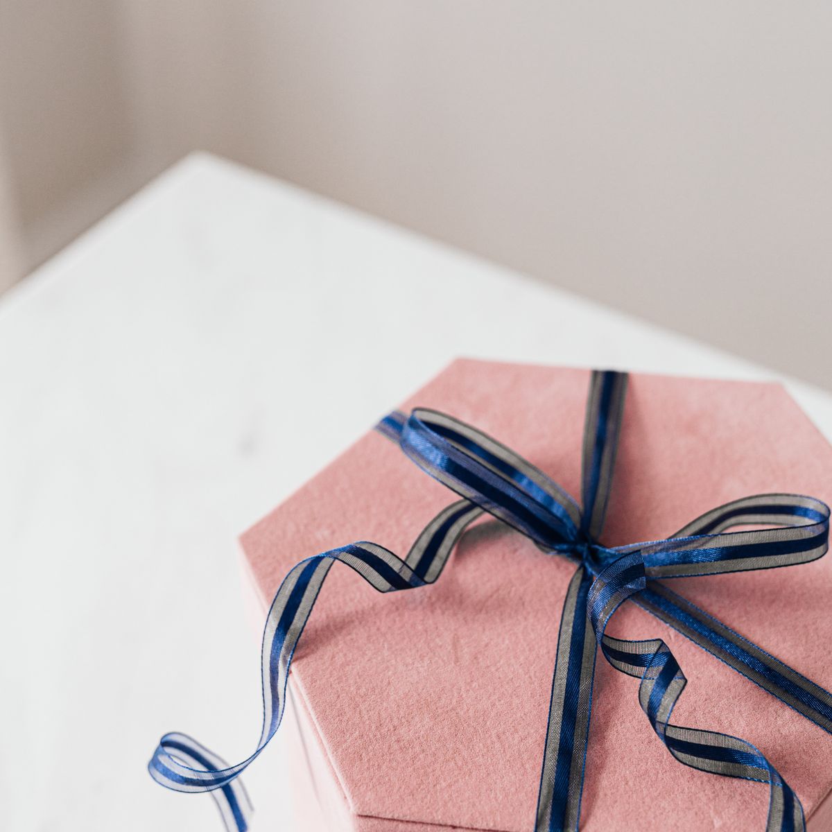 The Vaya box — blush gift box tied with ribbon
